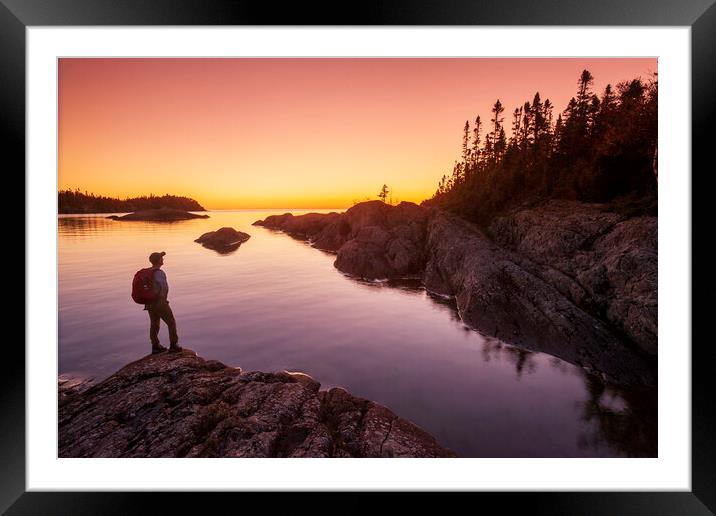 hiker along shoreline Framed Mounted Print by Dave Reede