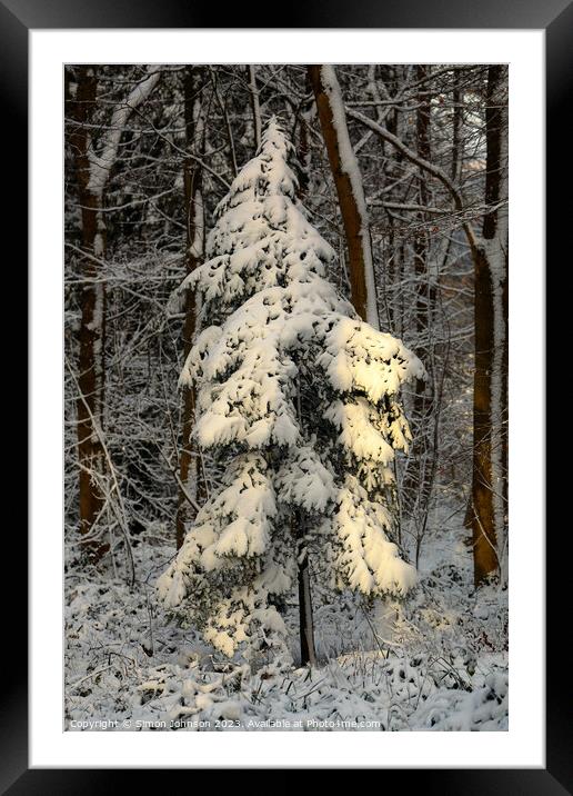 A pile of snow next to a tree Framed Mounted Print by Simon Johnson