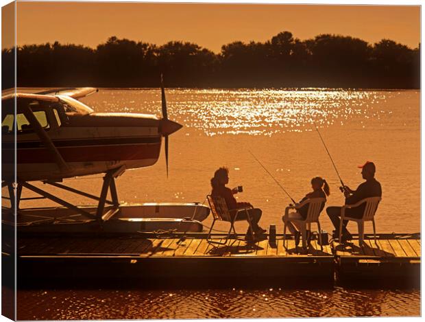 family on float plane dock Canvas Print by Dave Reede