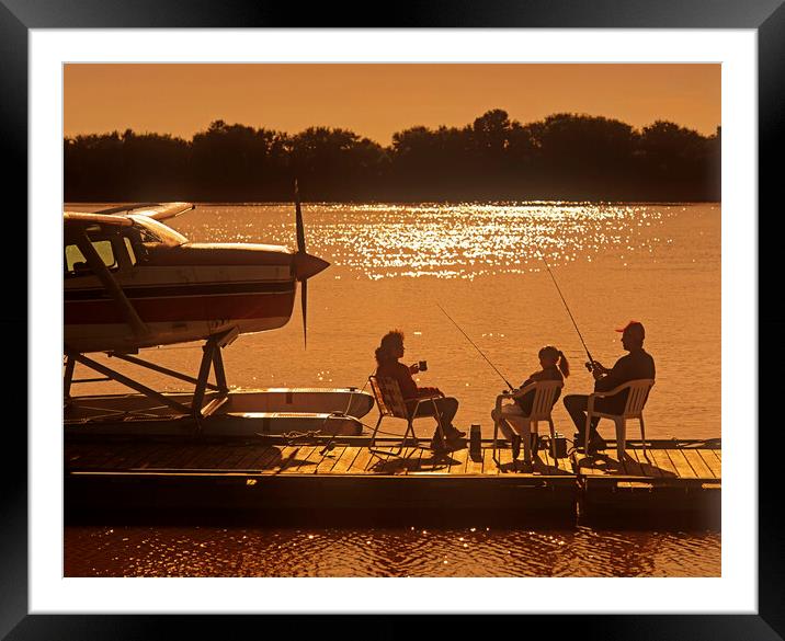 family on float plane dock Framed Mounted Print by Dave Reede