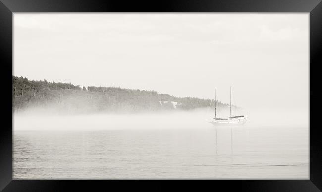 Misty Shore with Boat Framed Print by Kevin Howchin