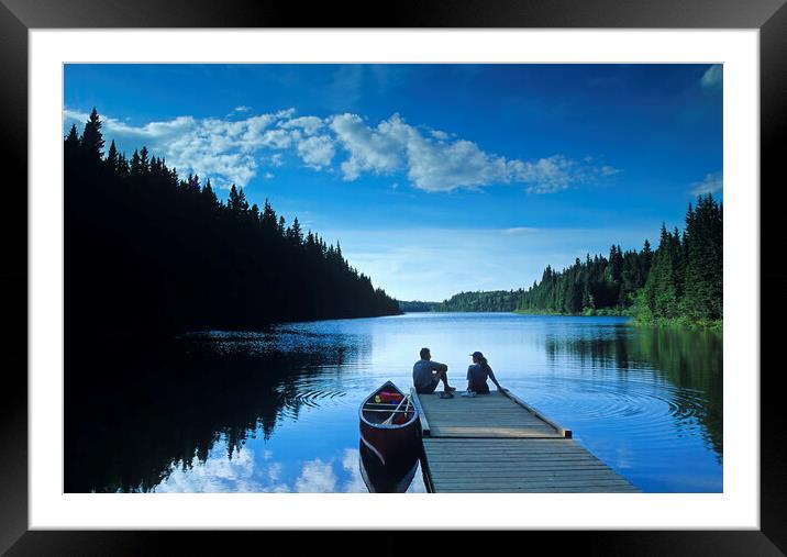couple relaxing after canoeing Framed Mounted Print by Dave Reede