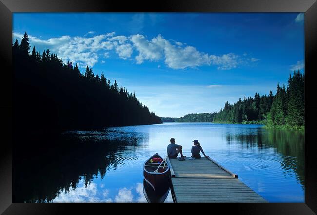 couple relaxing after canoeing Framed Print by Dave Reede