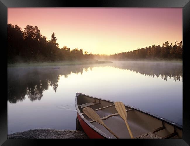 canoe along the Whiteshell River Framed Print by Dave Reede