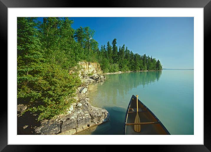canoe along Little Limestone Lake Framed Mounted Print by Dave Reede