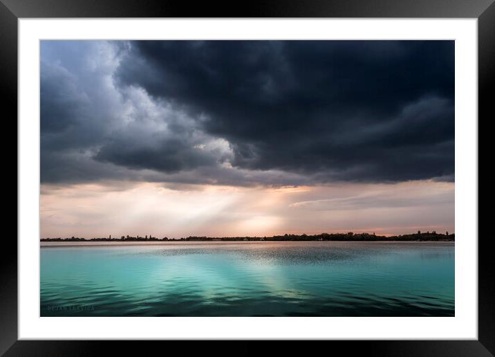 Turquoise lake under the cloudy sky Framed Mounted Print by Dejan Travica