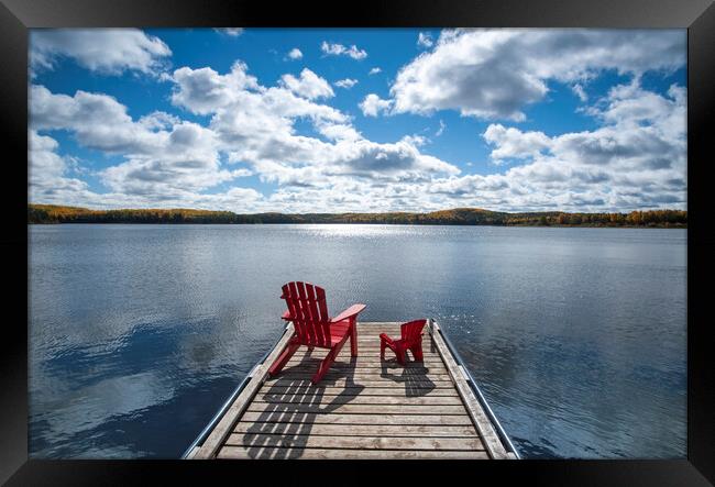 chairs on dock Framed Print by Dave Reede