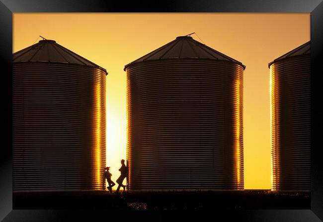 father and son next to grain bins Framed Print by Dave Reede