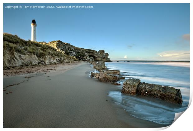 Lossiemouth lighthouse, with Covesea caves and beach below Print by Tom McPherson