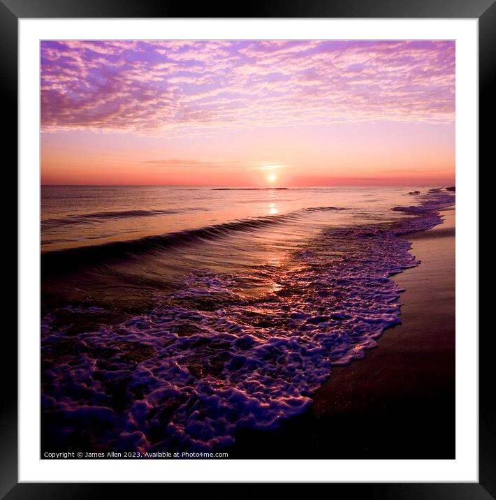 A sunset over a beach next to the ocean Framed Mounted Print by James Allen