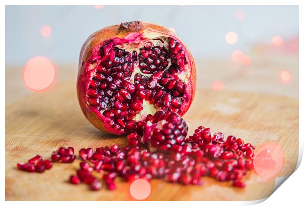 Pomegranate seeds amongst red lights Print by Jason Wells