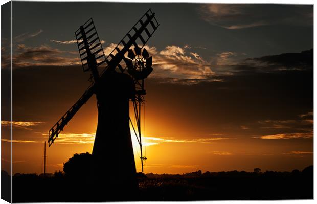 Sunsets behind Thurne Mill Canvas Print by Stephen Mole
