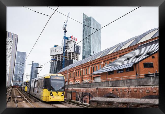 Metrolink tram approaching Manchester city centre Framed Print by Jason Wells