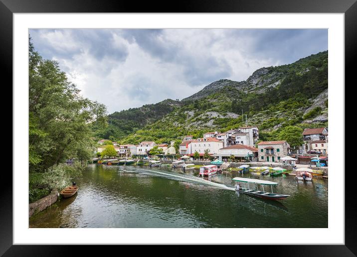 Boat rushes along Rijeka Crnojevica Framed Mounted Print by Jason Wells