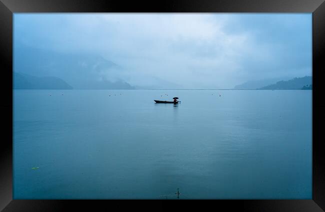 boatman fishing on phewa lake Framed Print by Ambir Tolang