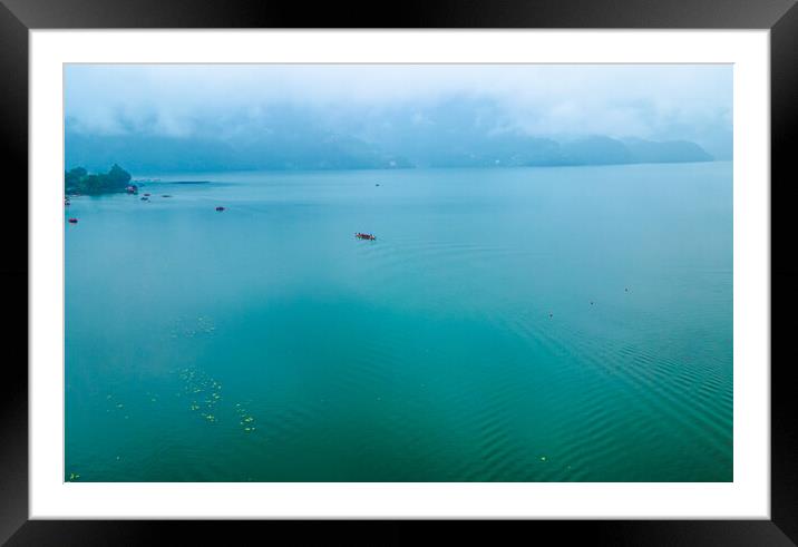 boatman fishing on phewa lake Framed Mounted Print by Ambir Tolang