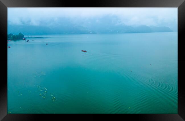 boatman fishing on phewa lake Framed Print by Ambir Tolang