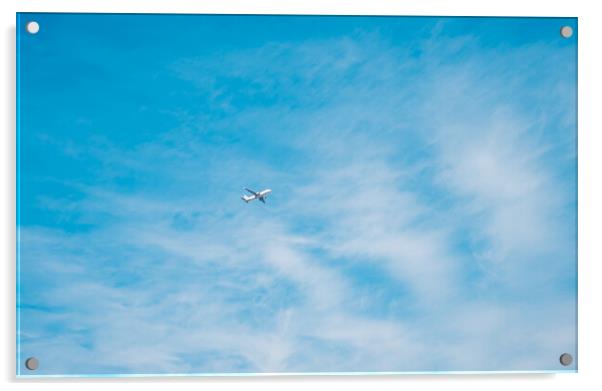 aircraft flying through a cloudy blue sky Acrylic by Ambir Tolang