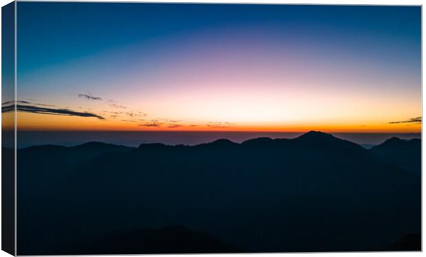 landscape view of sunrise over the Mountain Canvas Print by Ambir Tolang