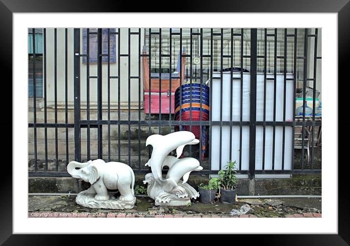 Elephant and Dolphins on a Ho Chi Minh City sidewalk. Framed Mounted Print by Kevin Plunkett