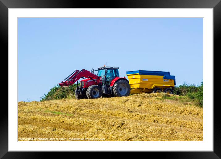 A Massey Ferguson tractor and trailer in a field Framed Mounted Print by Michael Harper