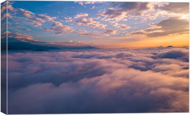 Landscape view of sunrise over the foggy during winter season Canvas Print by Ambir Tolang