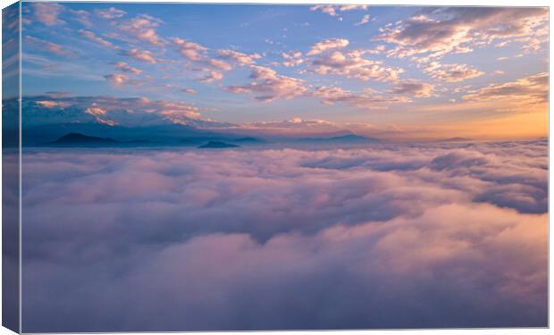 Landscape view of sunrise over the foggy during winter season Canvas Print by Ambir Tolang