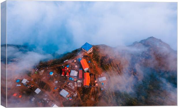 aerial  view of sunrise over the foggy during winter season Canvas Print by Ambir Tolang