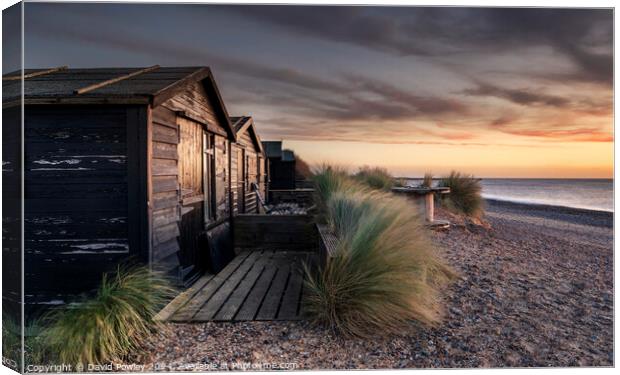 Walberswick Beach Huts At Sunrise Canvas Print by David Powley