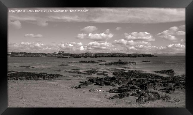 Rocky beach at Borthwen, Rhoscolyn Framed Print by Derek Daniel