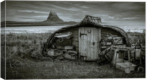 Lindisfarne Boatshed and Castle Canvas Print by John Frid