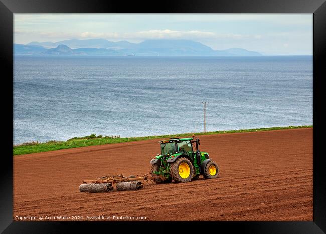 Tractor preparing field for crop planting, Ayrshir Framed Print by Arch White