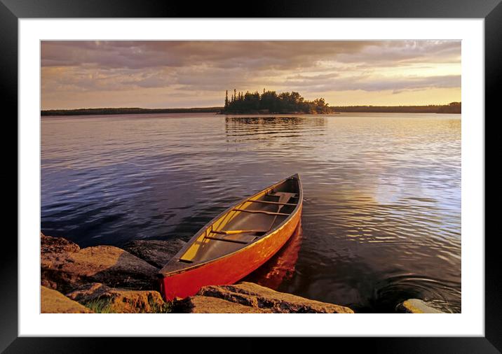 canoe on Nutimik Lake Framed Mounted Print by Dave Reede