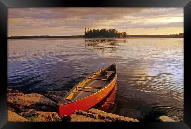 canoe on Nutimik Lake Framed Print by Dave Reede