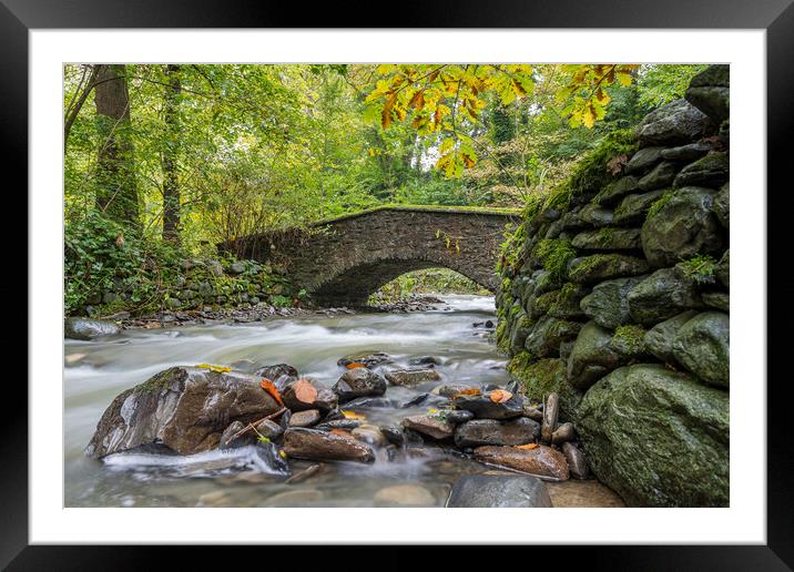 Flowing water under an old bridge Framed Mounted Print by Jason Wells
