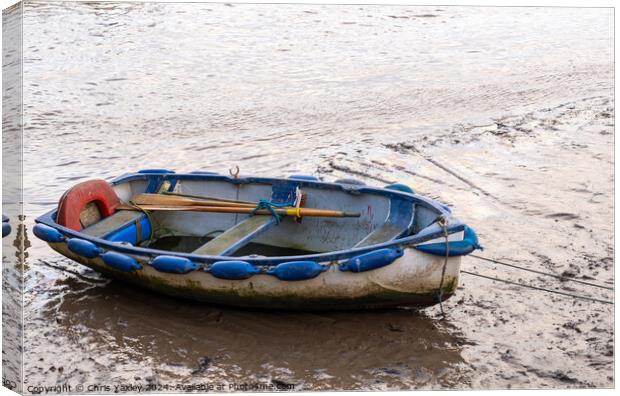 Row boat beached at low tide Canvas Print by Chris Yaxley