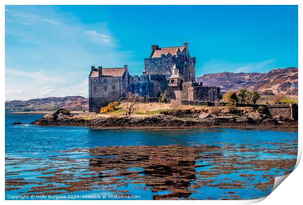Eilean Donan A castle surrounded by a body of wate Print by Holly Burgess