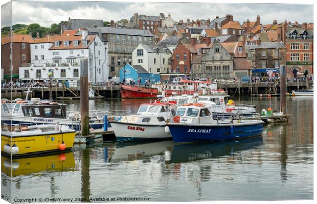 Fishing boats in Whitby harbour Canvas Print by Chris Yaxley