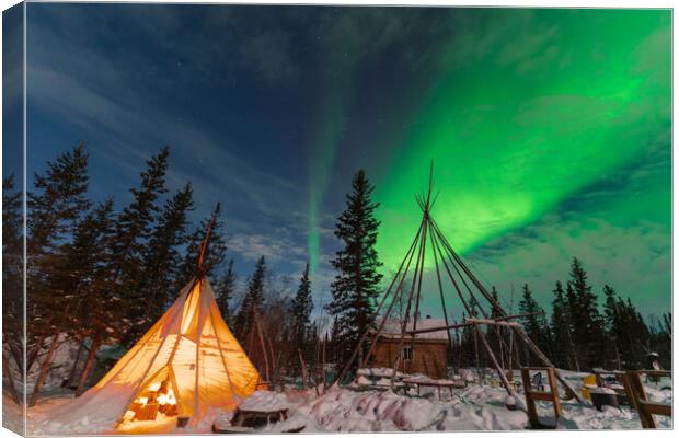 Aurora Borealis, Northern Lights, over aboriginal tent teepee at Yellowknife, Northwest Territories, Canada Canvas Print by Chun Ju Wu