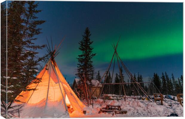 Aurora Borealis, Northern Lights, over aboriginal tent teepee at Yellowknife, Northwest Territories, Canada Canvas Print by Chun Ju Wu