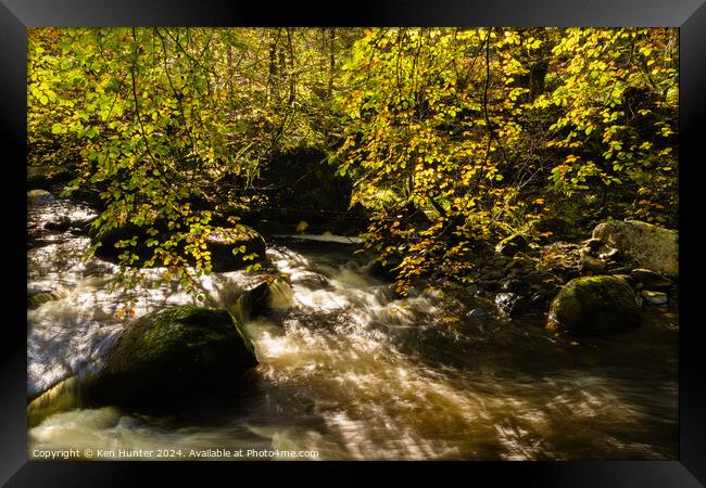 Dappled Sunlit Autumn Leaves and Rushing River Framed Print by Ken Hunter