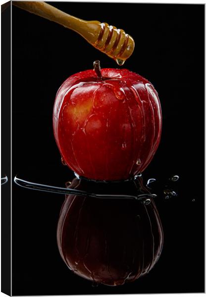Red apple with honey on black Canvas Print by Olga Peddi