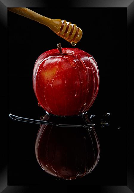 Red apple with honey on black Framed Print by Olga Peddi