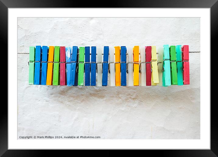 Clothes peg colours Framed Mounted Print by Mark Phillips