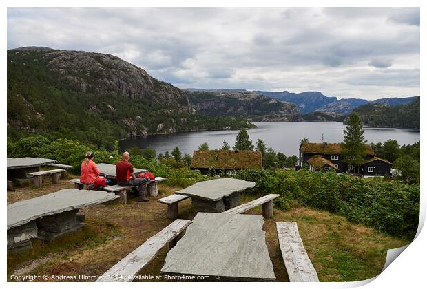 A couple relaxes at Preikestolen Base Camp with a view of Lake R Print by Andreas Himmler