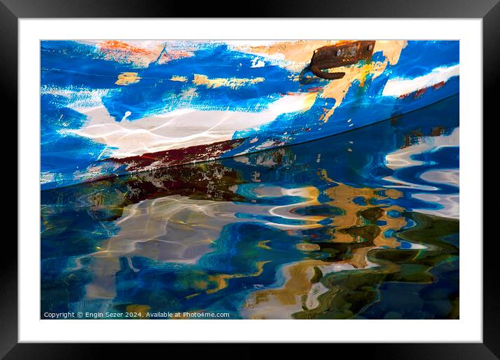 Abstract reflections of an old colorful wooden fishing boat on sea surface Framed Mounted Print by Engin Sezer