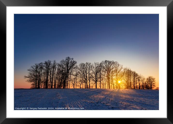 Winter landscape at cold evening. Framed Mounted Print by Sergey Fedoskin