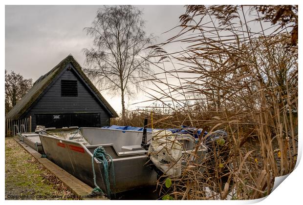 Boats outside the boat shed at How Hill staithe, Norfolk Broads Print by Chris Yaxley