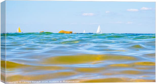 Sailing boats and waves seen by a swimmer at sea level, photogra Canvas Print by Laurent Renault