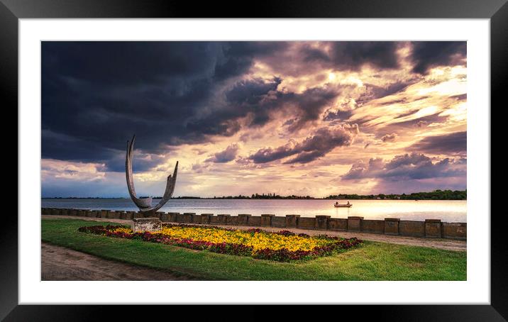 The sculpture Wings on the Palic lake under the cloudy sky Framed Mounted Print by Dejan Travica